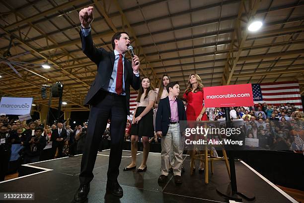 Republican presidential candidate Sen. Marco Rubio speaks as daughters Amanda and Daniella, son Anthony and wife Jeanette Dousdebes Rubio listen...