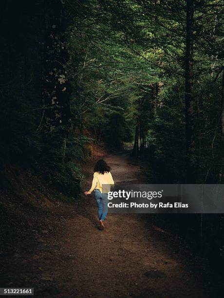 woman running away in forest - break out stock pictures, royalty-free photos & images