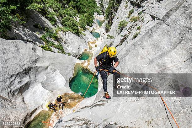 rappeling in the canyon with water pools - canyoning bildbanksfoton och bilder