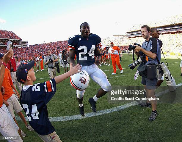 Carnell Williams of the Auburn Tigers jumps for joy after defeating the LSU Tigers in a game on September 18, 2004 at Jordan-Hare Stadium in Auburn,...