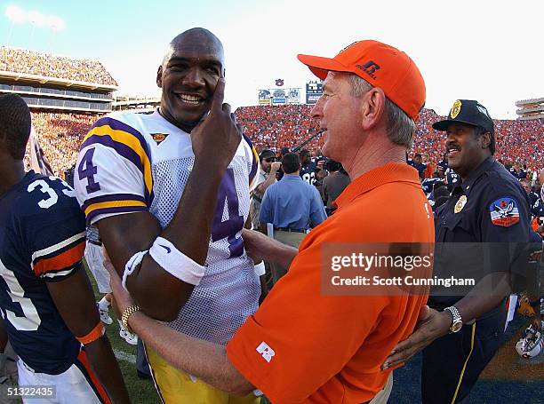 Head Coach Tommy Tuberville of the Auburn Tigers meets with LaMarcus Russell of the LSU Tigers after the game on September 18, 2004 at Jordan-Hare...