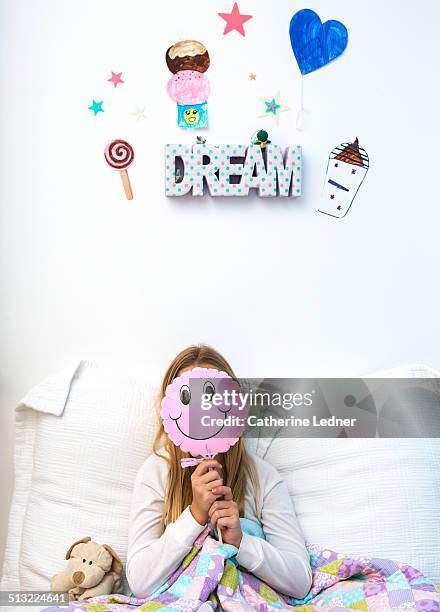 girl with smiley face balloon - smiley face balloon stock pictures, royalty-free photos & images