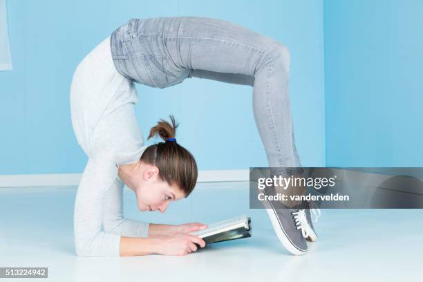 relaxing with a good book - double jointed stock pictures, royalty-free photos & images