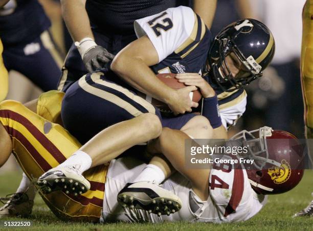 Shaun Cody of USC sacks John Beck quarterback for BYU on September 18, 2004 at Lavell Edwards Stadium in Provo, Utah. USC won the game over BYU 42-10.