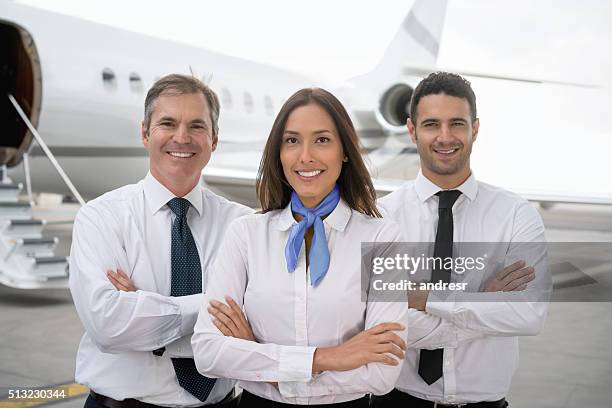 cabin crew at the airport - crew stock pictures, royalty-free photos & images