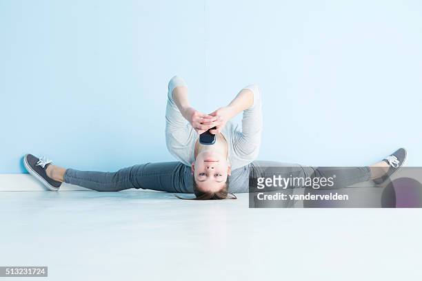 gymnast texting - contortionist stock pictures, royalty-free photos & images