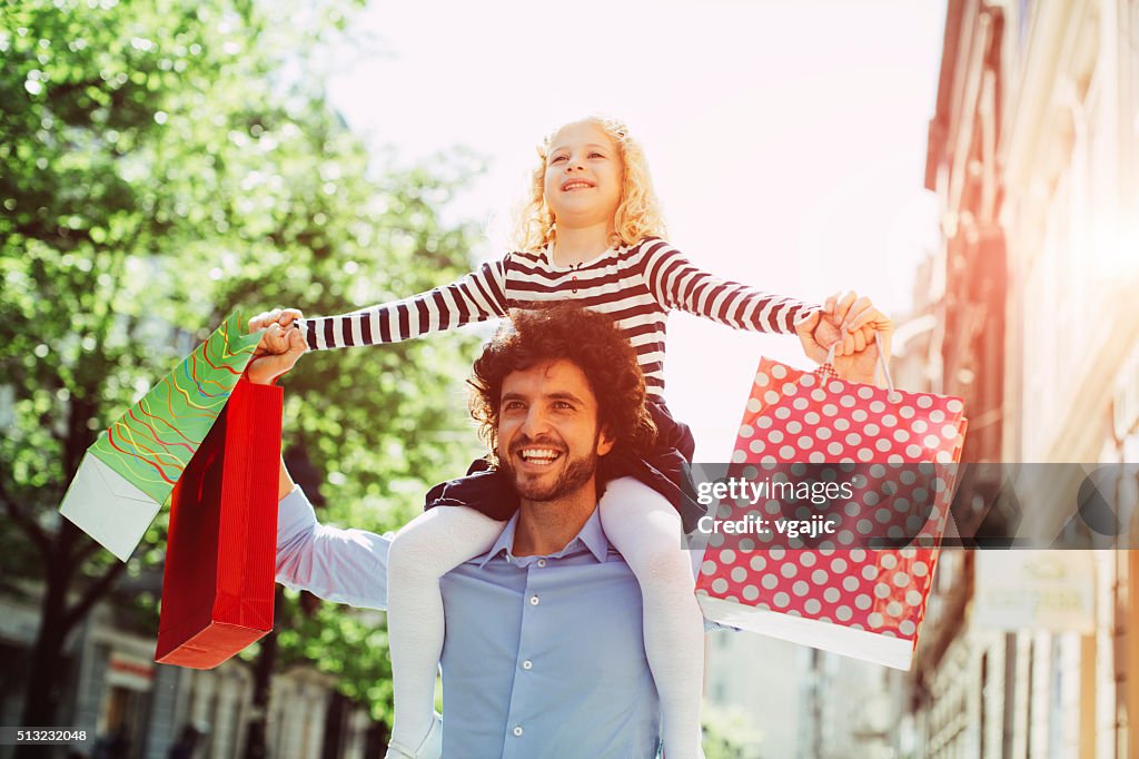 Father And Daughter Shopping Together.