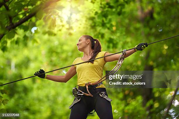 having fun in adventure park. - safety harness military stock pictures, royalty-free photos & images
