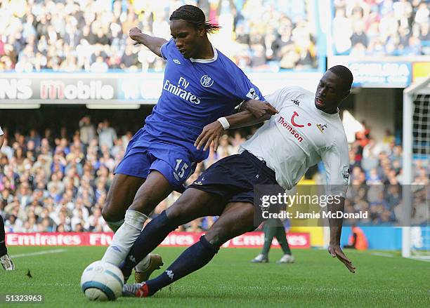 Didier Drogba of Chelsea is tackled by Ledley King of Spurs during the Barclays Premiership match between Chelsea and Tottenham Hotspur on September...