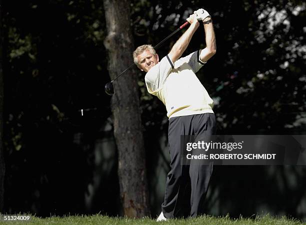 European Ryder Cup golfer Colin Montgomerie of Scotland watches his tee shot on the second hole during his singles match against David Toms 19...