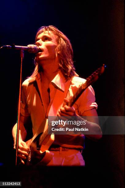 American musician Robin Zander sings and plays guitar as he performs with Cheap Trick at the Riviera Theater, Chicago, Illinois, October 29, 1977.