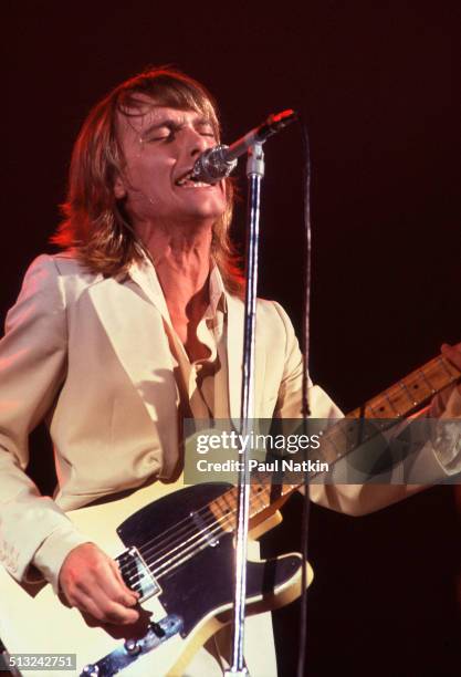 American musician Robin Zander sings and plays guitar as he performs with Cheap Trick at the Riviera Theater, Chicago, Illinois, October 29, 1977.