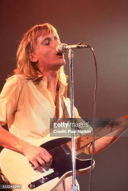 American musician Robin Zander sings and plays guitar as he performs with Cheap Trick at the Riviera Theater, Chicago, Illinois, October 29, 1977.