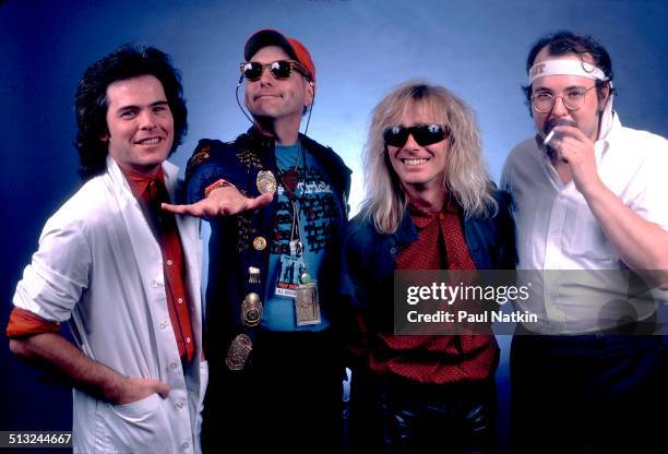 Portrait of, from left, Jon Brandt, Rick Nielsen, Robin Zander, and Bun E Carlos, of the band Cheap Trick, as they pose at the Poplar Creek Music...