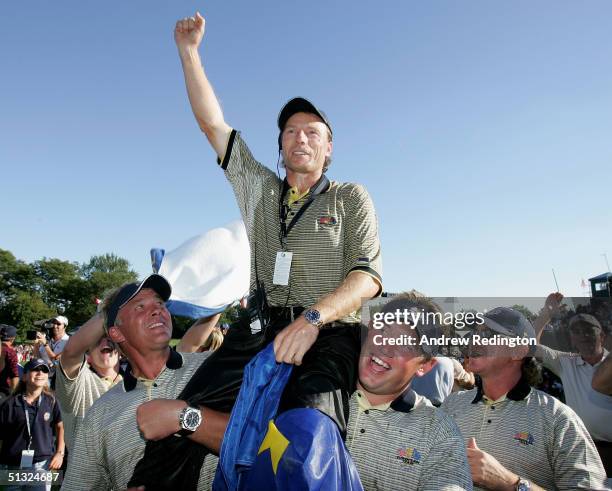 European team captain Bernhard Langer celebrates with his teammates after Europe win the Ryder Cup Cup 18 1/2 to 9 1/2 at the 35th Ryder Cup Matches...