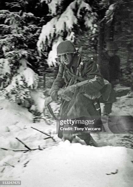 American troops take part in an attack on a German machine-gun position during the Battle of the Bulge in the Ardennes, Belgium, December 1944.