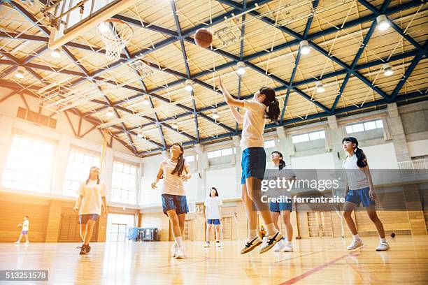 female basketball team playing in japanese high school - association of east asian relations and japan stock pictures, royalty-free photos & images