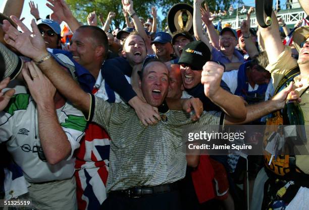 European Team player Thomas Levet is mobbed by the fans after Europe's victory over the USA during the Sunday singles matches at the 35th Ryder Cup...