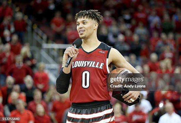 Damion Lee of the Louisville Cardinals talks to the crowd following the 56-53 win over the Georgia Tech Yellow Jackets on Senior Night at KFC YUM!...