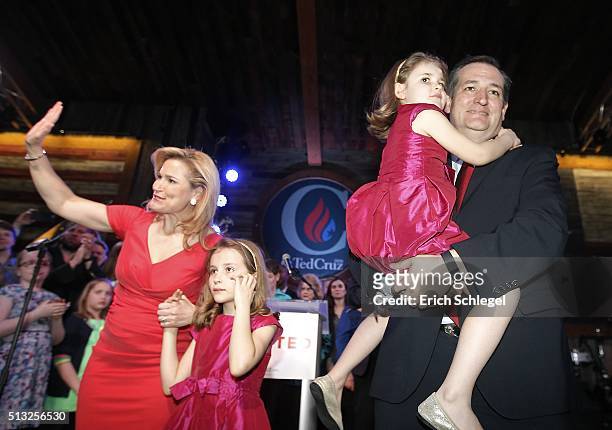 Republican presidential candidate, Sen. Ted Cruz celebrates holding his daughter Catherine with his wife Heidi and daughter Caroline during a Super...