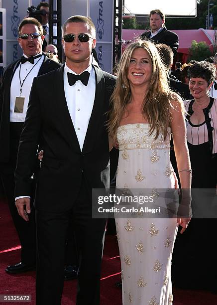 Actors Brad Pitt and Jennifer Aniston attend the 56th Annual Primetime Emmy Awards at the Shrine Auditorium September 19, 2004 in Los Angeles,...