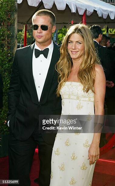 Actors Jennifer Aniston and husband Brad Pitt attend the 56th Annual Primetime Emmy Awards at the Shrine Auditorium September 19, 2004 in Los...