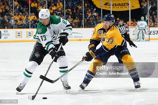 Ales Hemsky of the Dallas Stars skates against Colin Wilson of the Nashville Predators during an NHL game at Bridgestone Arena on March 1, 2016 in...