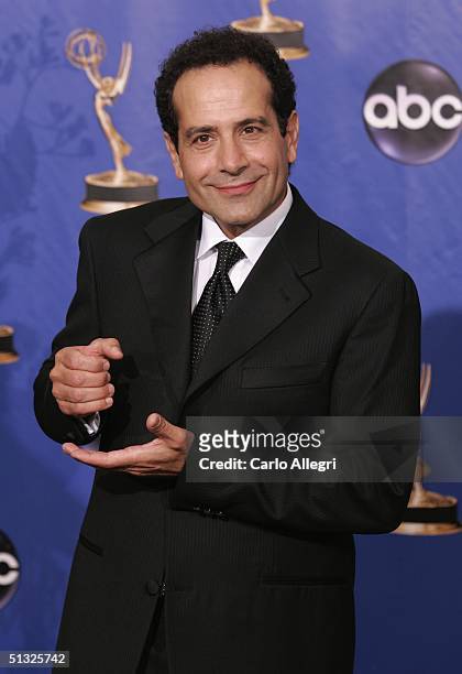 Actor Tony Shalhoub poses backstage during the 56th Annual Primetime Emmy Awards on September 19, 2004 at the Shrine Auditorium, in Los Angeles,...