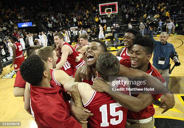 Guard Kevin "Yogi" Ferrell of the Indiana Hoosiers celebrates with teammates after they defeated the Iowa Hawkeyes to win the Big10 title on March 1,...