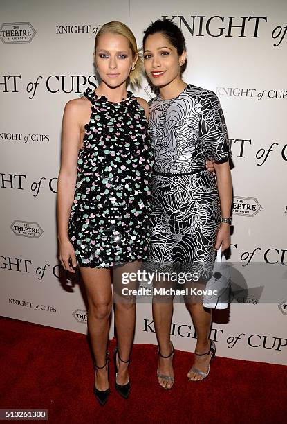 Actors Teresa Palmer and Freida Pinto attend the Los Angeles Premiere Of Broad Green Pictures' "Knight Of Cups" on March 1, 2016 in Los Angeles,...