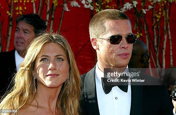 Actress Jennifer Aniston and Actor/husband Brad Pitt attend the 56th Annual Primetime Emmy Awards on September 19, 2004 at the Shrine Auditorium, in...
