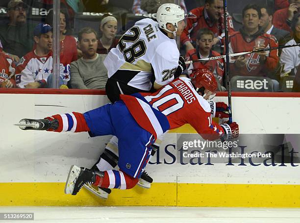 Washington Capitals center Mike Richards and Pittsburgh Penguins defenseman Ian Cole collide in the first period at the Verizon Center March 01, 2016...