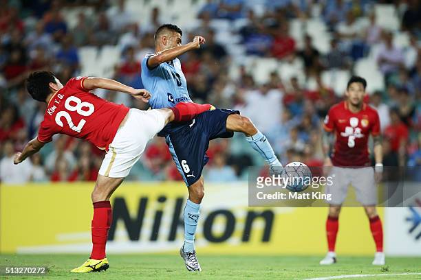 Robert Stambolziev of Sydney FC beats Kim Young-gwon of Guangzhou Evergrande to score the first goal during the AFC Champions League match between...