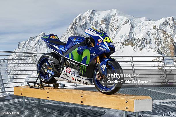 The 2016 Yamaha YZR-M1 of Valentino Rossi is pictured on the panoramic terrace of Punta Helbronner cable car station with the Mont Blanc summit on...