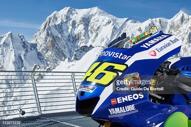 The 2016 Yamaha YZR-M1 of Valentino Rossi is pictured on the panoramic terrace of Punta Helbronner cable car station with the Mont Blanc summit on...