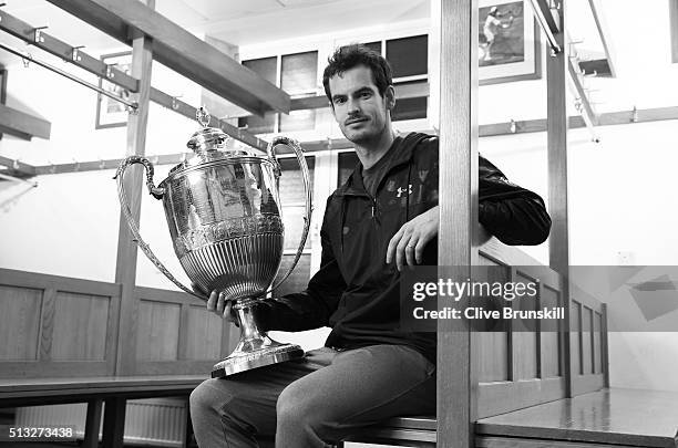 Andy Murray holds the Aegon Championships trophy at The Queens Club Dressing Rooms on February 26, 2016 in London,United Kingdom. Which he will try...