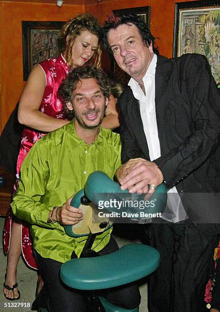 Rory Keegan and Nicky Haslam attend Hugh Hefner's 75th Birthday Party at China White Nightclub on May 18, 2001 in London.
