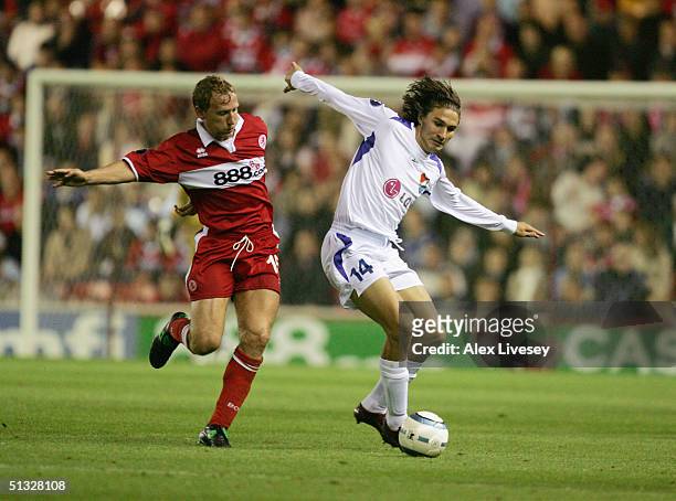 Michael Papadopulos of Banik Ostrava holds off Ray Parlour of Middlesbrough during the UEFA Cup first round, first leg match between Middlesbrough...