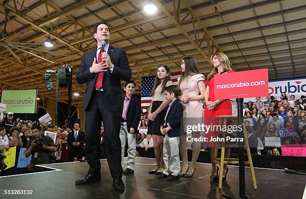 Republican presidential candidate Sen. Marco Rubio speaks as daughters Amanda and Daniella, son Anthony and Dominick and wife Jeanette Dousdebes...