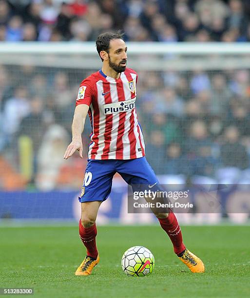 Juanfran of Club Atletico de Madrid in action during the La Liga match between Real Madrid CF and Club Atletico de Madrid at Estadio Santiago...