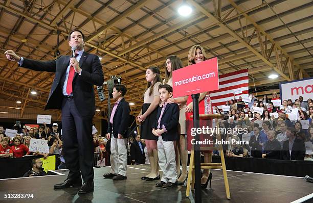 Republican presidential candidate Sen. Marco Rubio speaks as daughters Amanda and Daniella, son Anthony and Dominick and wife Jeanette Dousdebes...