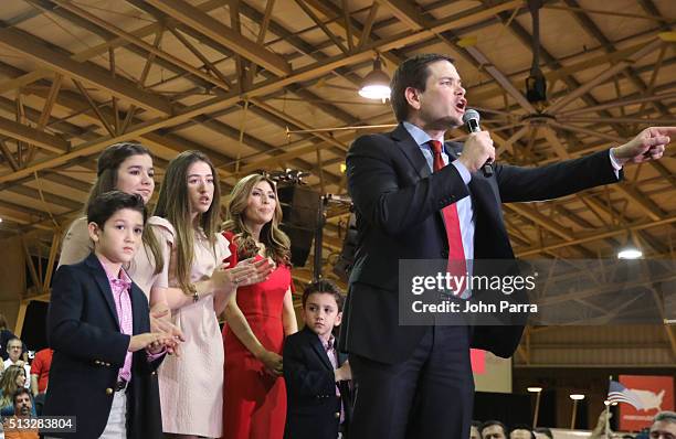 Republican presidential candidate Sen. Marco Rubio speaks as daughters Amanda and Daniella, son Anthony and Dominick and wife Jeanette Dousdebes...