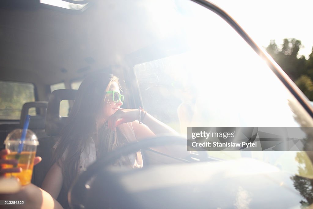 Girl in car enjoying bubble tea