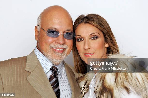 Celine Dion and her husband Rene Angelil pose for a picture backstage during the 2004 World Music Awards at the Thomas and Mack Center on September...