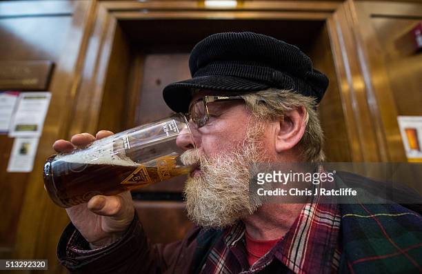 Beer lover John Conway enjoys a pale ale at the London Drinker Beer and Cider Festival at the Camden Centre on March 2, 2016 in London, England. The...