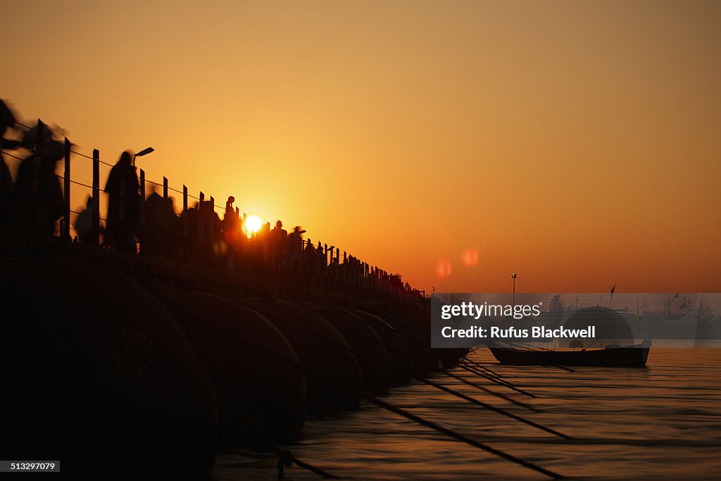 Sun rises over floating bridge