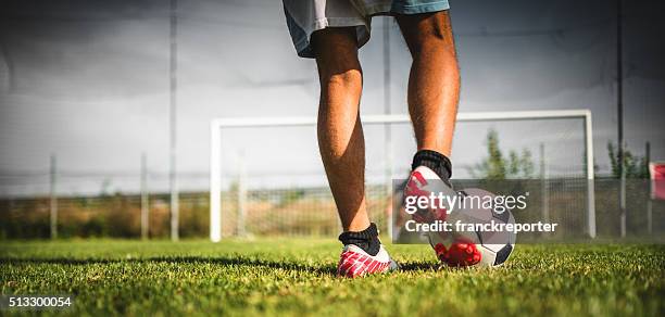 soccer player at the penalty - studded footwear stock pictures, royalty-free photos & images