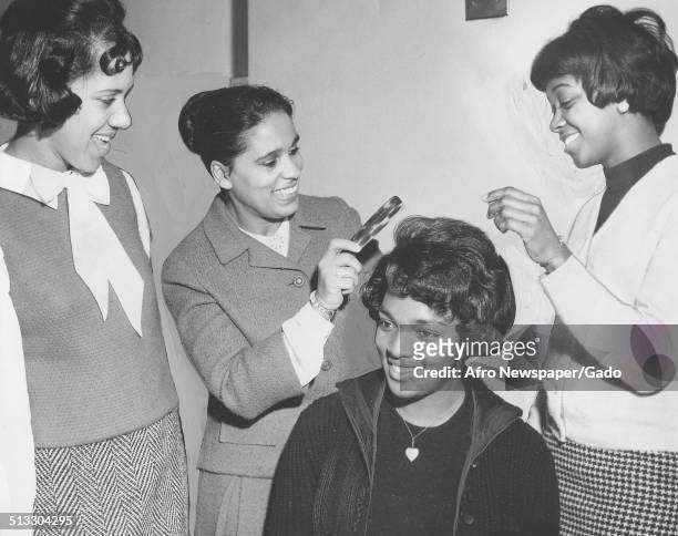 Marguerite Belafonte giving a hairstyling demonstration at Morgan State University, Baltimore, Maryland, January 23, 1965.