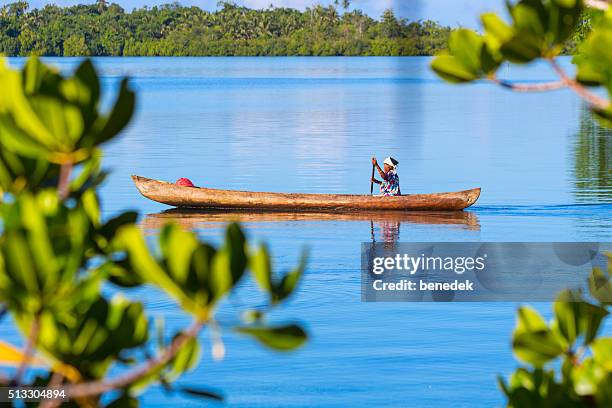 woman canoeing at langa langa lagoon solomon islands - salomonseilanden stockfoto's en -beelden