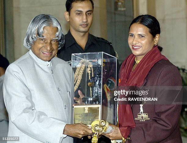 Indian Athlete Madhuri Saxena receives the prestigious Arjuna Award, from Indian President A.P.J. Abdul Kalam during an awards function at the...